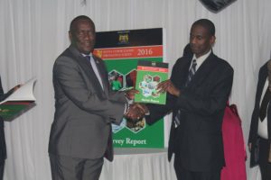 Chair of the Parliamentary TB Caucus, Hon. Stephen Mule (left) and the Head of Clinical Services at the Ministry of Health, Dr. Izaq Odongo (right) during the Kenya TB Prevalence Survey Report dissemination forum